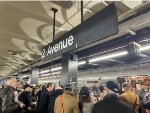 Crowd of people surrounding the Holiday Train at 2nd Ave Station 